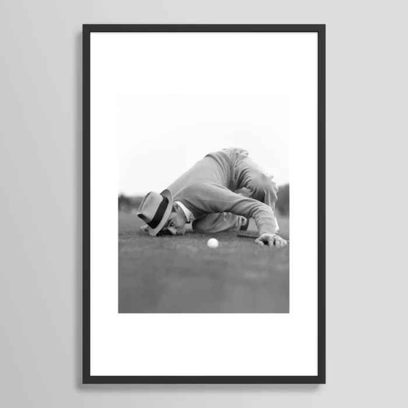 Eye to The Ground on The 18th Hole Golfing Man Eyes Ball to Measure Distance to Hole